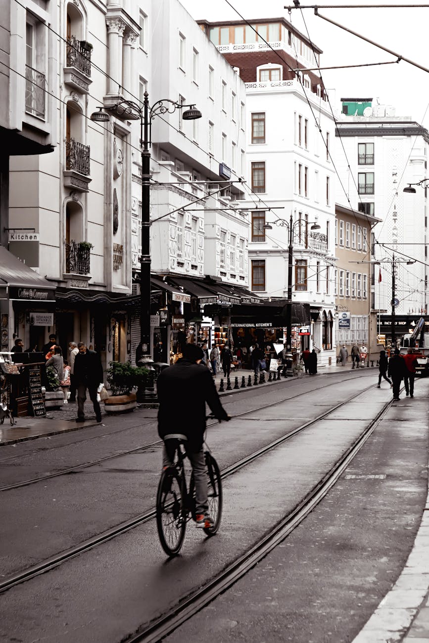 people walking and riding bicycle on city street