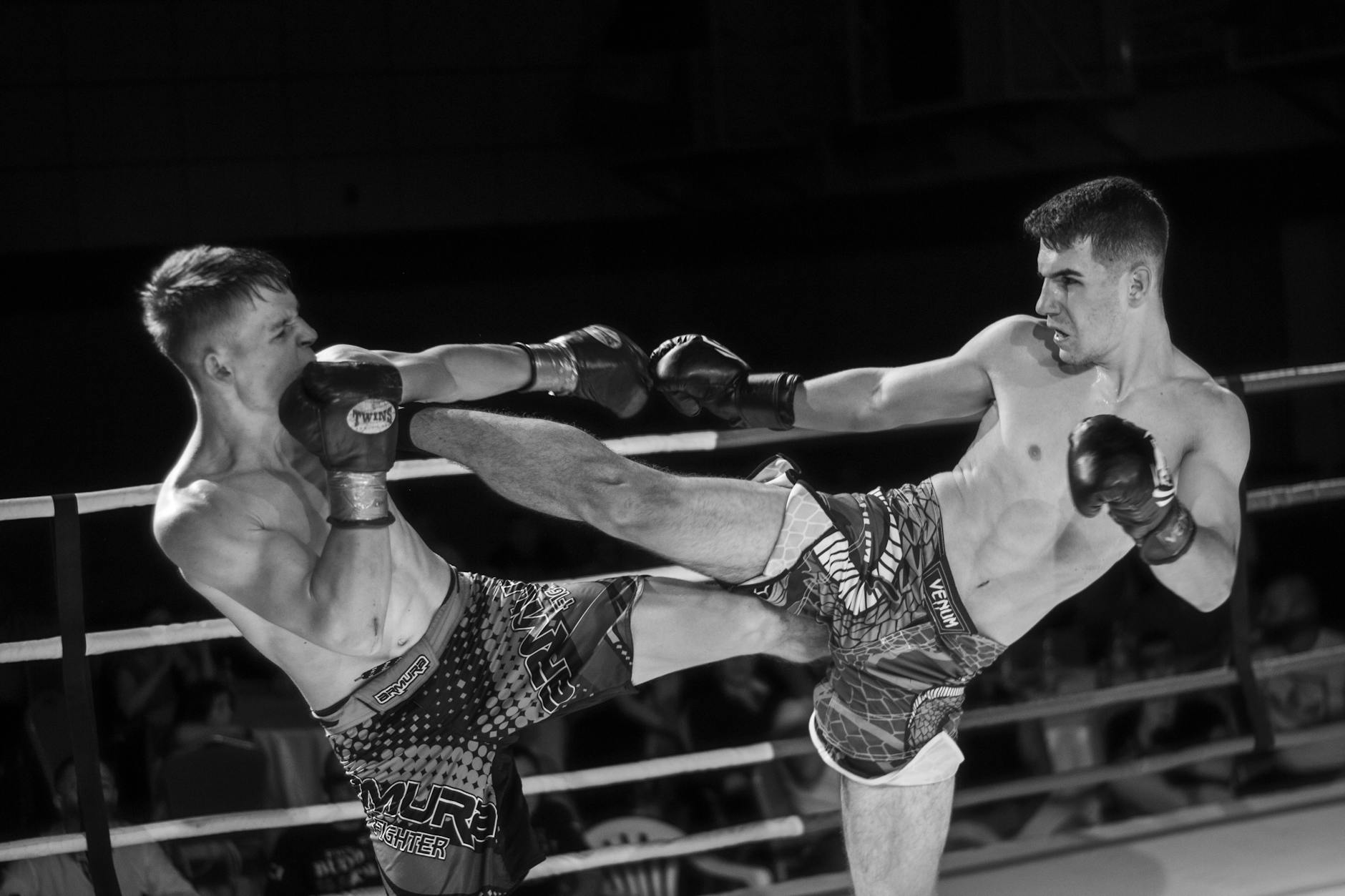 men fighting in the ring