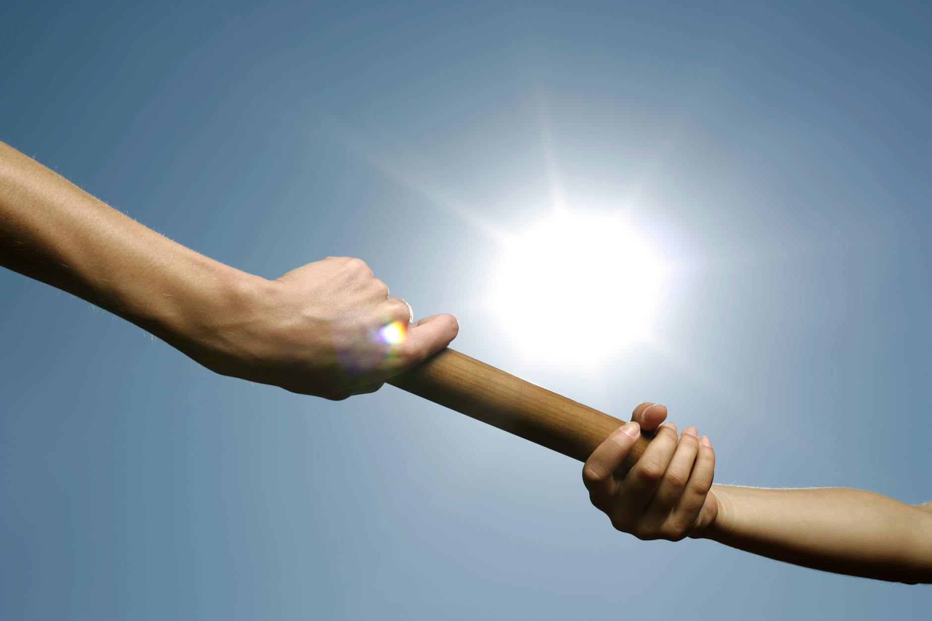 people passing a baton