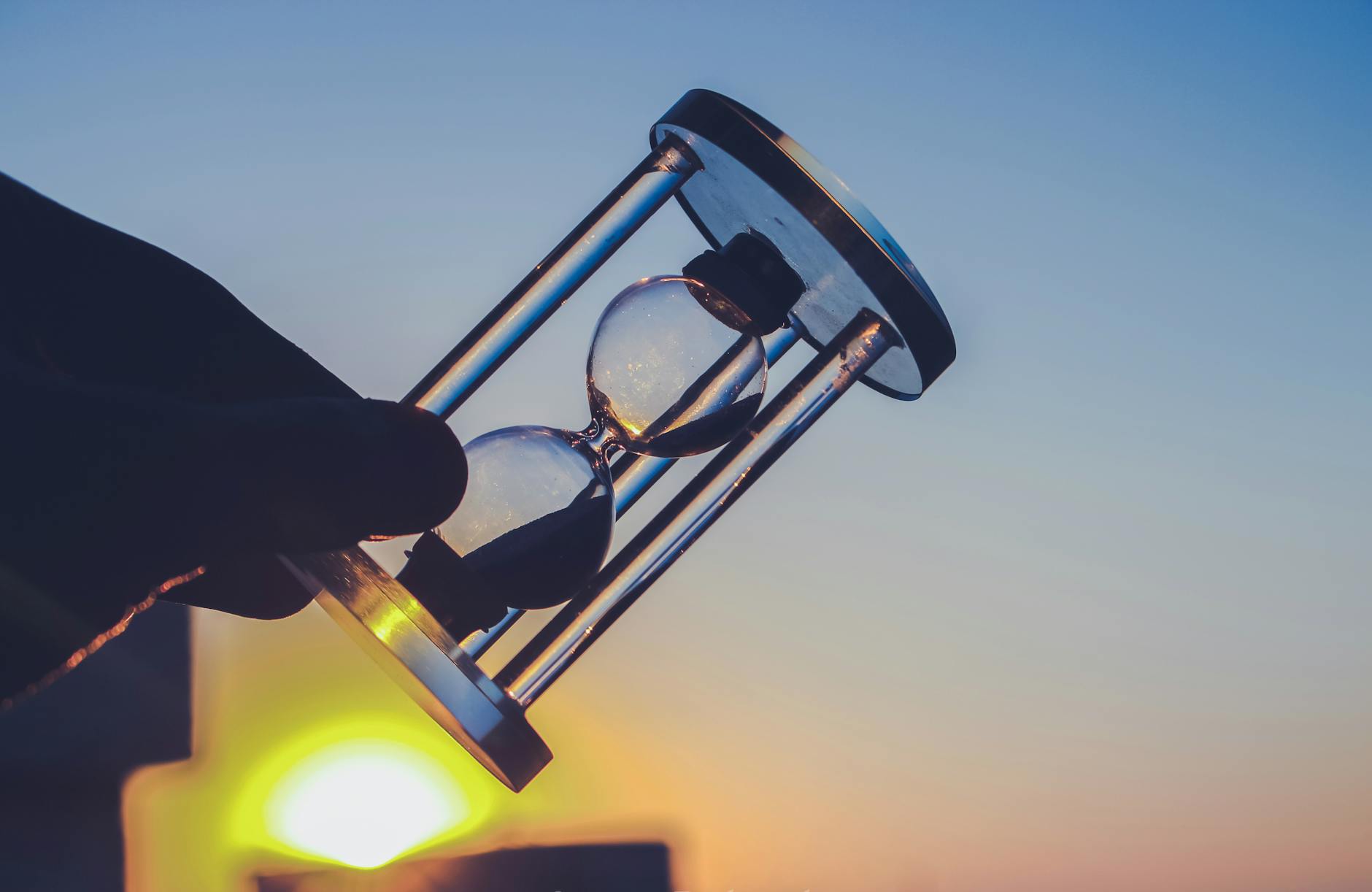 person holding hour glass