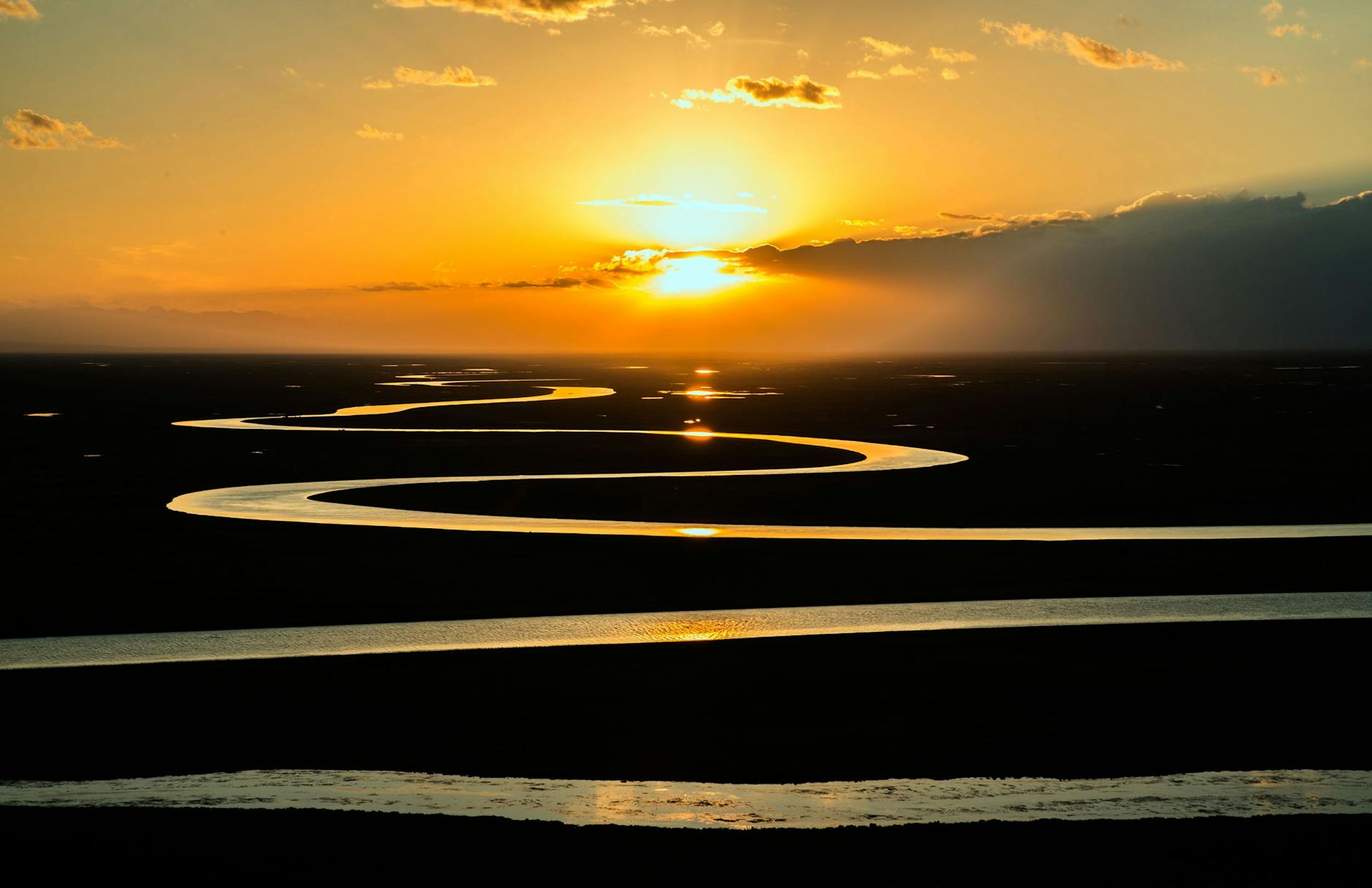 large body of water stream during dawn