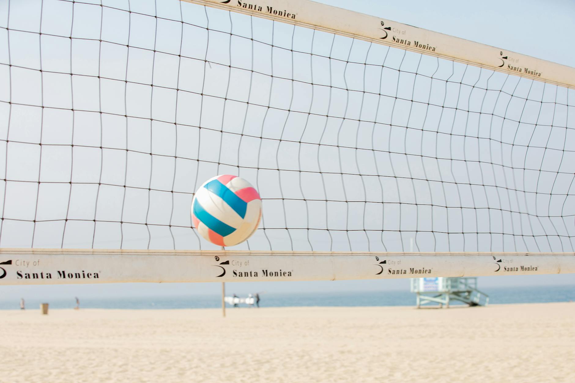 ball hitting a beach volleyball net
