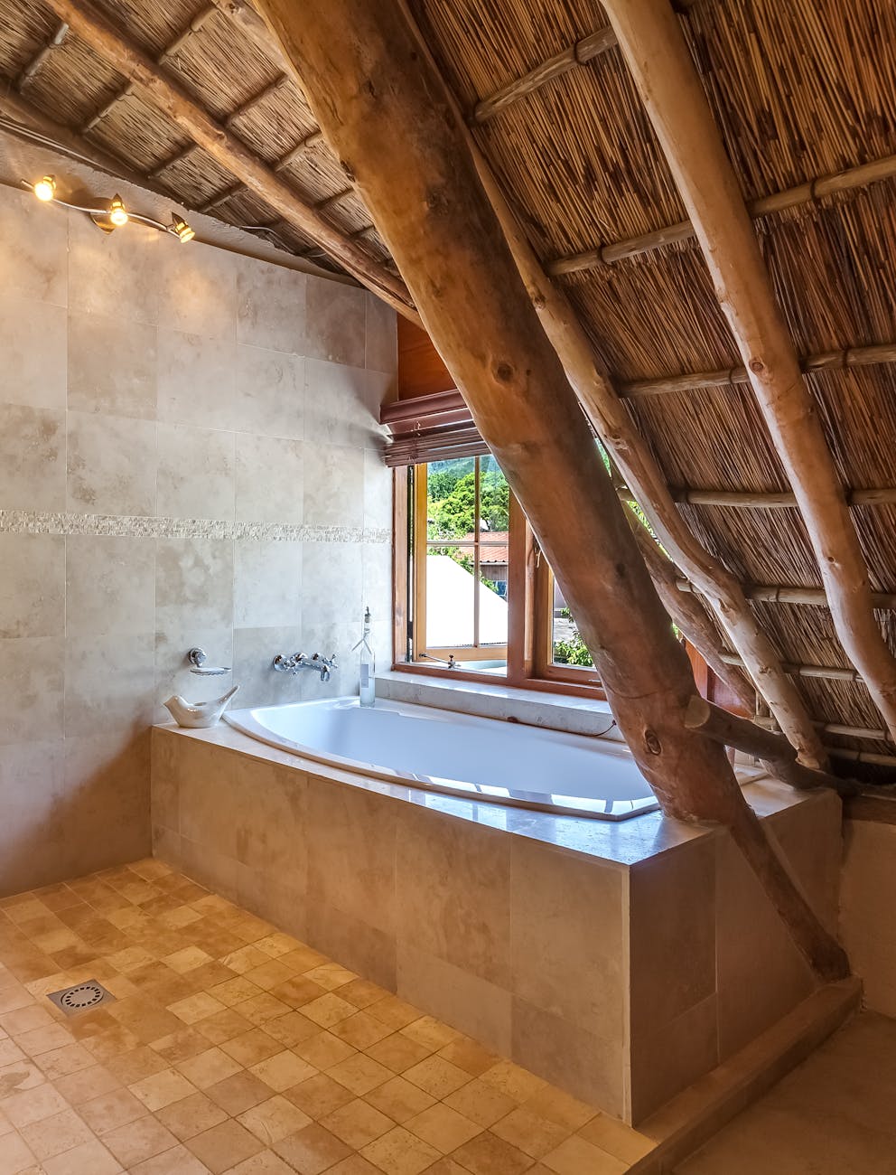 photo of bathtub beside window