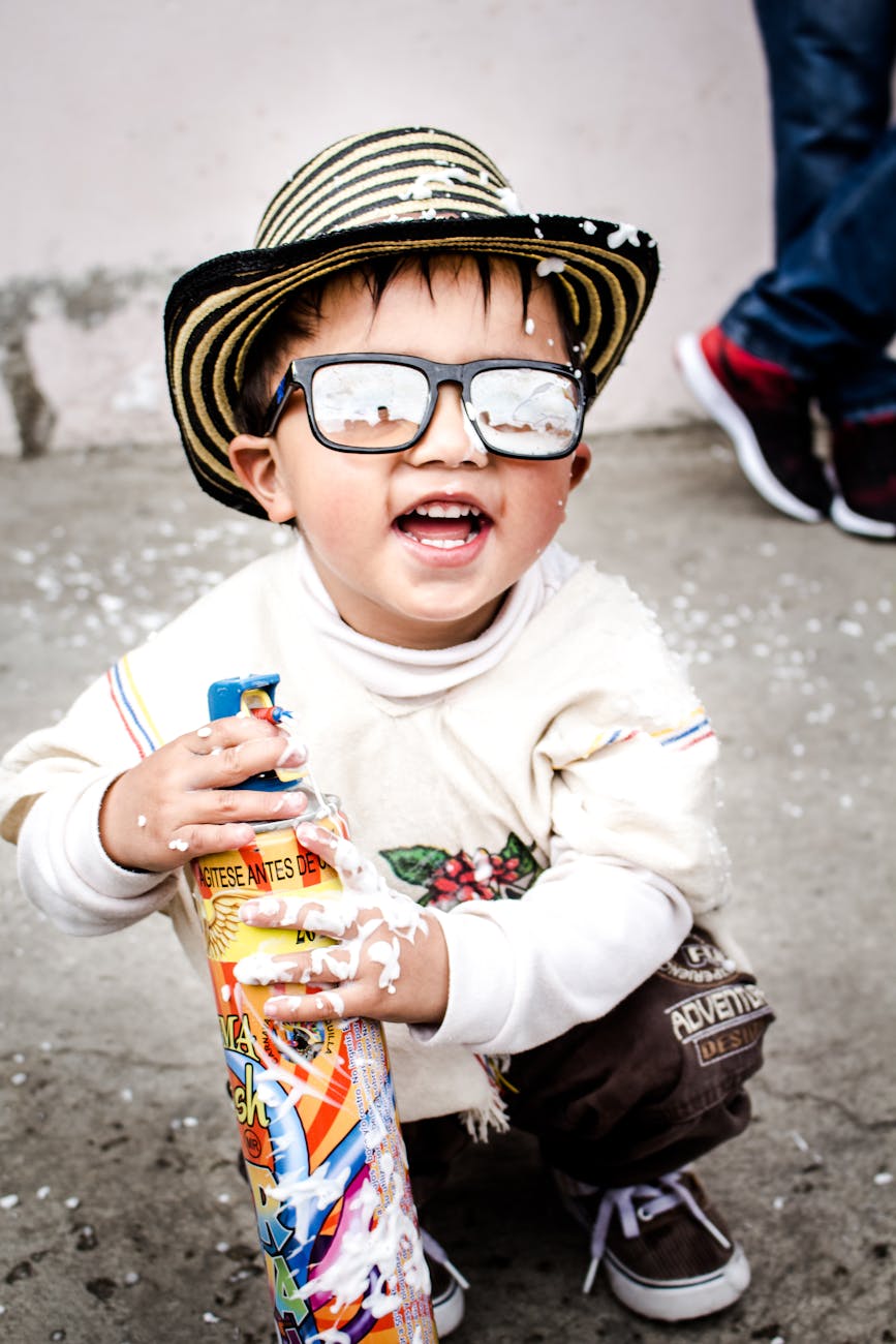 photography of kid wearing sunglasses