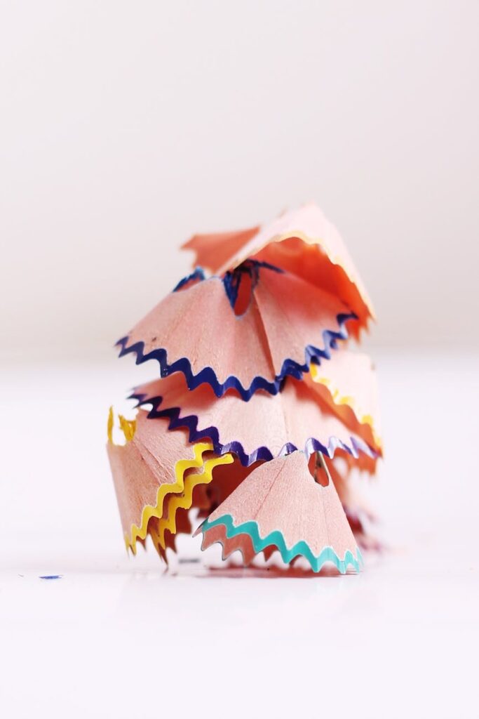 brown teal and yellow piles of pencil cuts