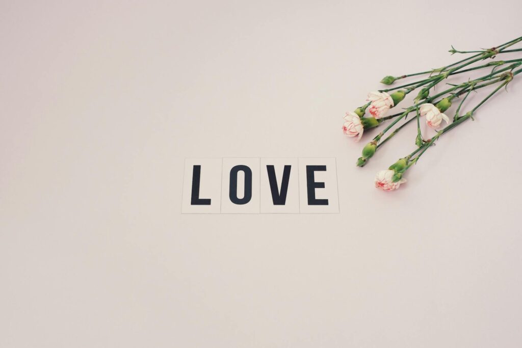 word love on white surface