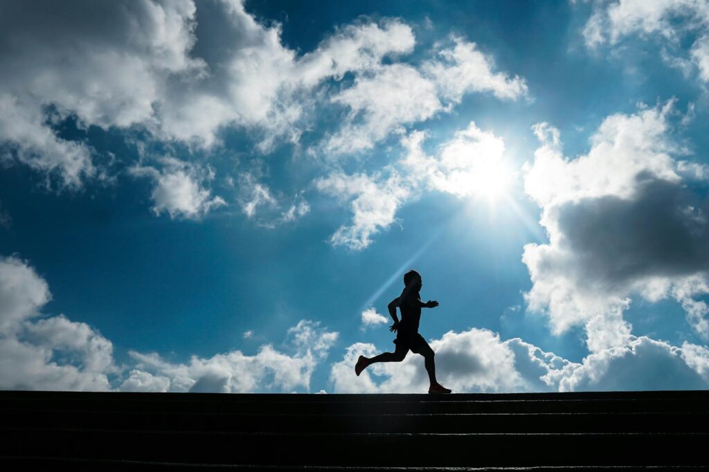 a man running under the sky