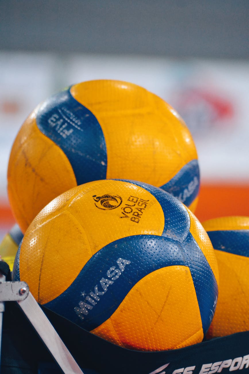 close up of colorful volleyballs in sports setting