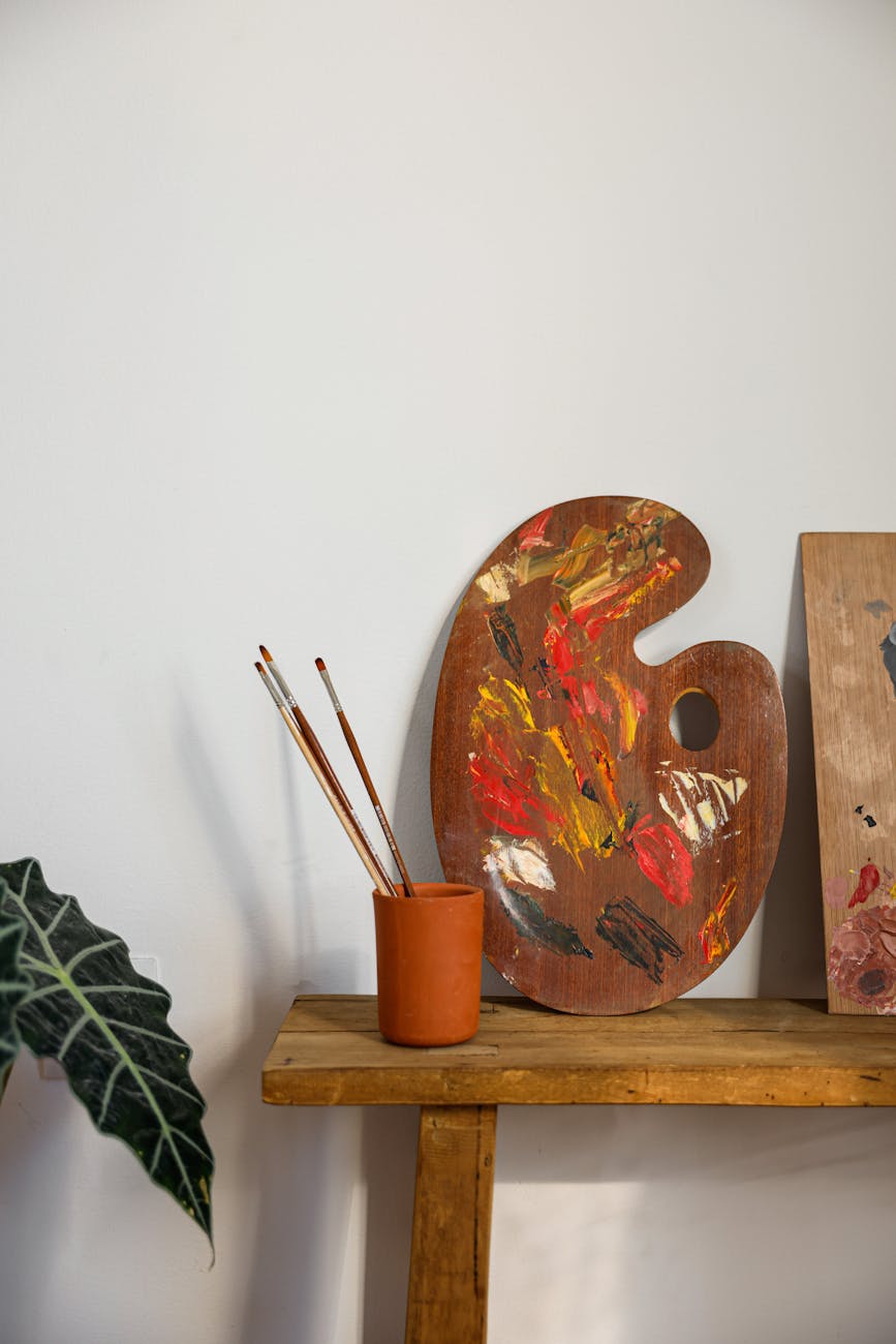 painting materials on a wooden stool