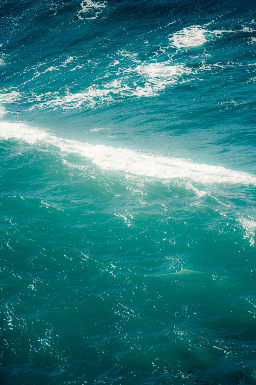 turquoise ocean waves with white foam