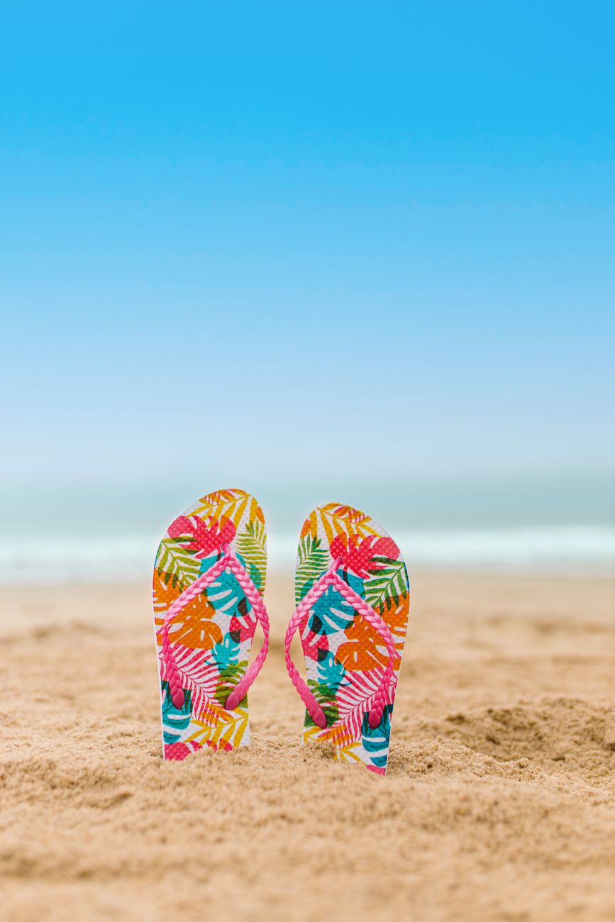 color flipflops on the sand