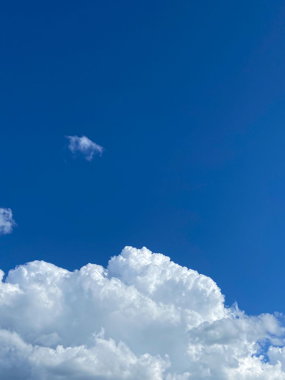 bright blue sky with fluffy white clouds