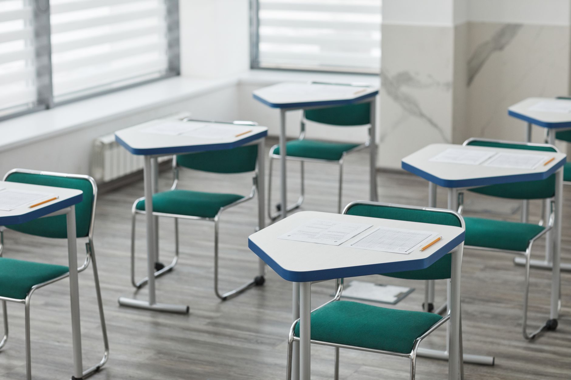 desks with papers on top